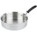 A silver Vollrath saute pan with a silicone-coated handle.