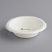 A white paper bowl with green text that says "EarthChoice"