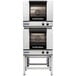 A stainless steel Moffat Turbofan double deck electric convection oven with both doors open.