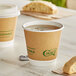 Two EcoChoice Kraft paper hot cups with tea and a tea bag on a table.