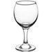 An Acopa clear wine glass.