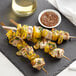 A skewer of chicken and pineapple on a Bamboo by EcoChoice green bamboo food pick.