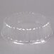 A clear plastic Solut catering tray lid with a circular design.
