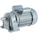 A grey electric motor with a round metal shaft.