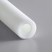 A roll of white plastic with a small hole in it.