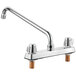 A silver deck-mount Regency faucet with two handles.