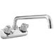 A chrome Regency wall mount faucet with two handles and a 14" swing spout.