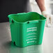 A close-up of a green San Jamar Cleaning Kleen-Pail Pro bucket with white text on it.