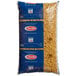 A Barilla bag of Medium Shell Pasta with blue labels on a white background.