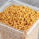 A case of Barilla Whole Grain Elbow Pasta on a school kitchen counter.