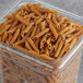 A case of Barilla Whole Grain Penne Rigate pasta on a table.