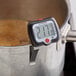 An AvaTemp digital candy thermometer in a pot of boiling water.