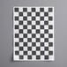 A Choice black and white checkered basket liner and sandwich wrap paper.