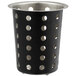 A black metal cylindrical flatware holder with holes in it.