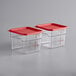 Two Vigor plastic containers with red lids.