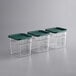 Three Vigor polycarbonate food storage containers with green lids.