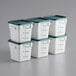 A stack of white Choice square polypropylene food storage containers with green lids.
