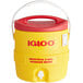 A yellow and red Igloo water cooler with the logo on it.