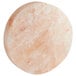 An 8" round pink Himalayan salt slab.