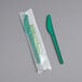 A green plastic knife in EcoChoice packaging.