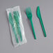 A green EcoChoice CPLA fork and knife wrapped in plastic.