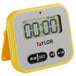 A yellow and white Taylor digital kitchen timer with a clock on it.