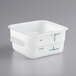 A white square Carlisle food storage container with green writing on it.