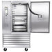 A Traulsen stainless steel commercial blast chiller with a door open on a tray.