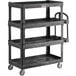 A black Rubbermaid heavy-duty utility cart with four shelves and wheels.