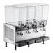 A Vollrath refrigerated beverage dispenser machine with four clear containers.