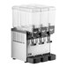 A Vollrath refrigerated beverage dispenser with three clear containers on top.