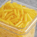 A box of Barilla gluten-free penne pasta on a table.