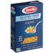 A blue box of Barilla gluten-free elbow pasta on a counter.