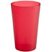 A red plastic tumbler with pebbled texture on a white background.