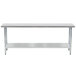 A long metal Advance Tabco stainless steel work table with a galvanized undershelf.