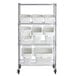 A metal shelving unit with white plastic bins clipped onto it.