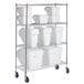 A metal shelving unit with white Baker's Mark clip-in containers on a metal shelf.