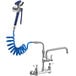 A Waterloo pet grooming faucet with a blue coiled hose attached.