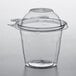 A Dart clear plastic snack cup with dome lid.