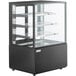 An Avantco black refrigerated bakery display case with glass shelves.