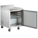 An Avantco stainless steel worktop freezer with a door open.