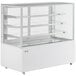 An Avantco white refrigerated bakery display case with glass shelves.