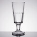 An Anchor Hocking clear soda glass with a small rim on top.