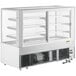 An Avantco white refrigerated bakery display case with glass doors.