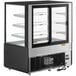 A black Avantco refrigerated bakery display case with glass doors and shelves.