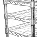 A Metro Super Erecta wine rack with cradles on four shelves.