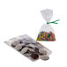 A Choice clear polypropylene bag filled with chocolate cookies with white sprinkles and candy.