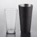 An Acopa Boston shaker set with a clear mixing glass and black matte tin.