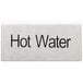 A close-up of a stainless steel "Hot Water" table tent sign with black text.