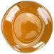 A close up of a brown International Tableware Luna terracotta porcelain pasta plate.